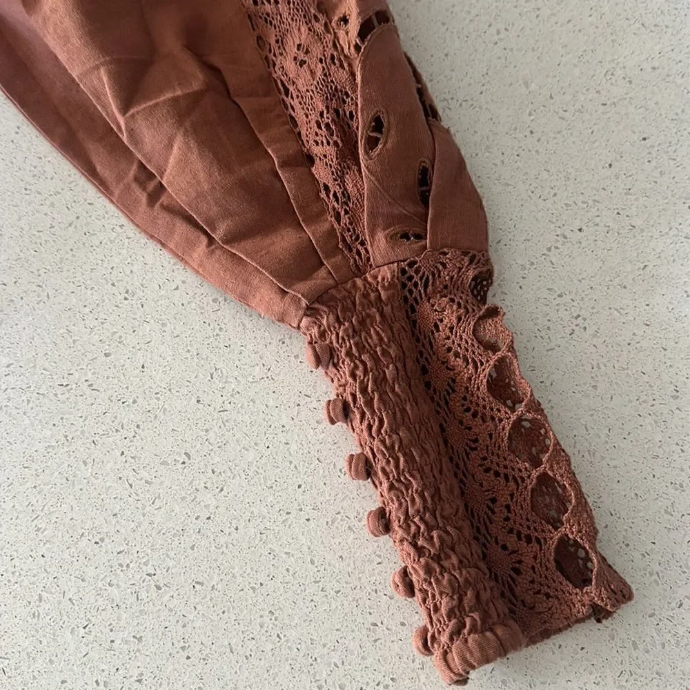 NWOT Free People Regina Bodysuit Top Thong Eyelet Balloon Sleeves Smocked Retro